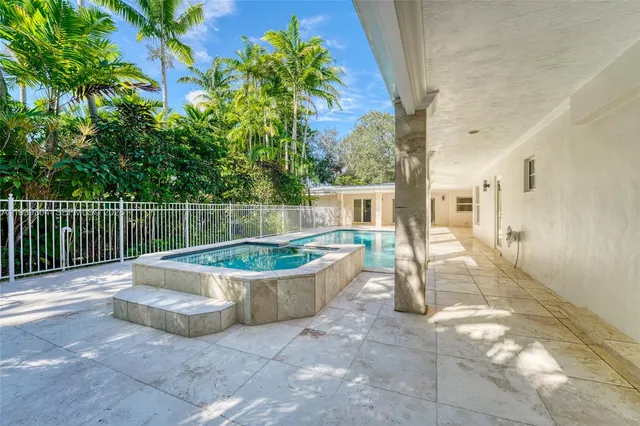a view of a house with a yard and tree s