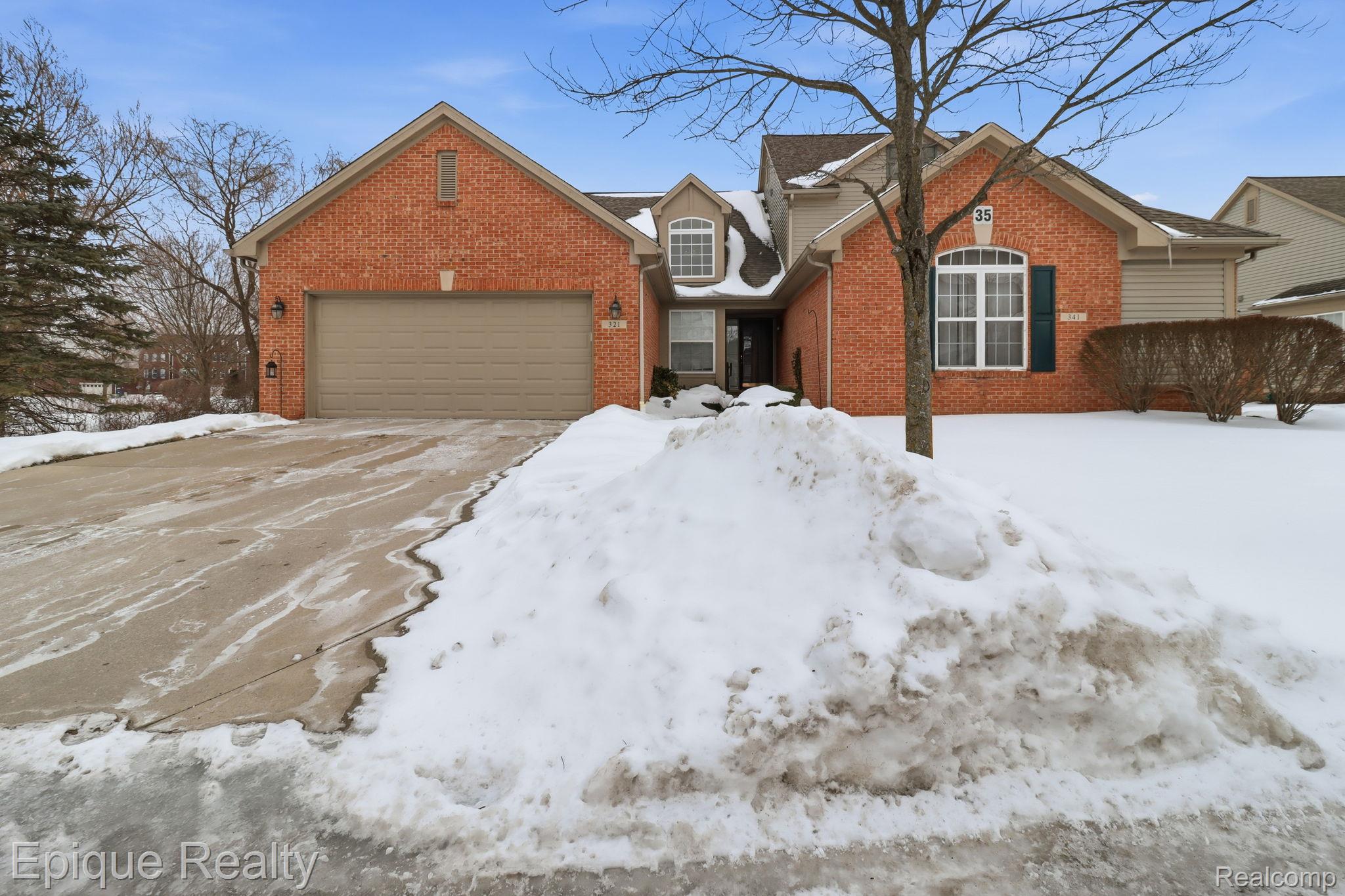 321 Cherry Grove Road Canton, MI 48188 - Photo 1 of 22 Traditional home with brick siding, concrete driveway, and a garage