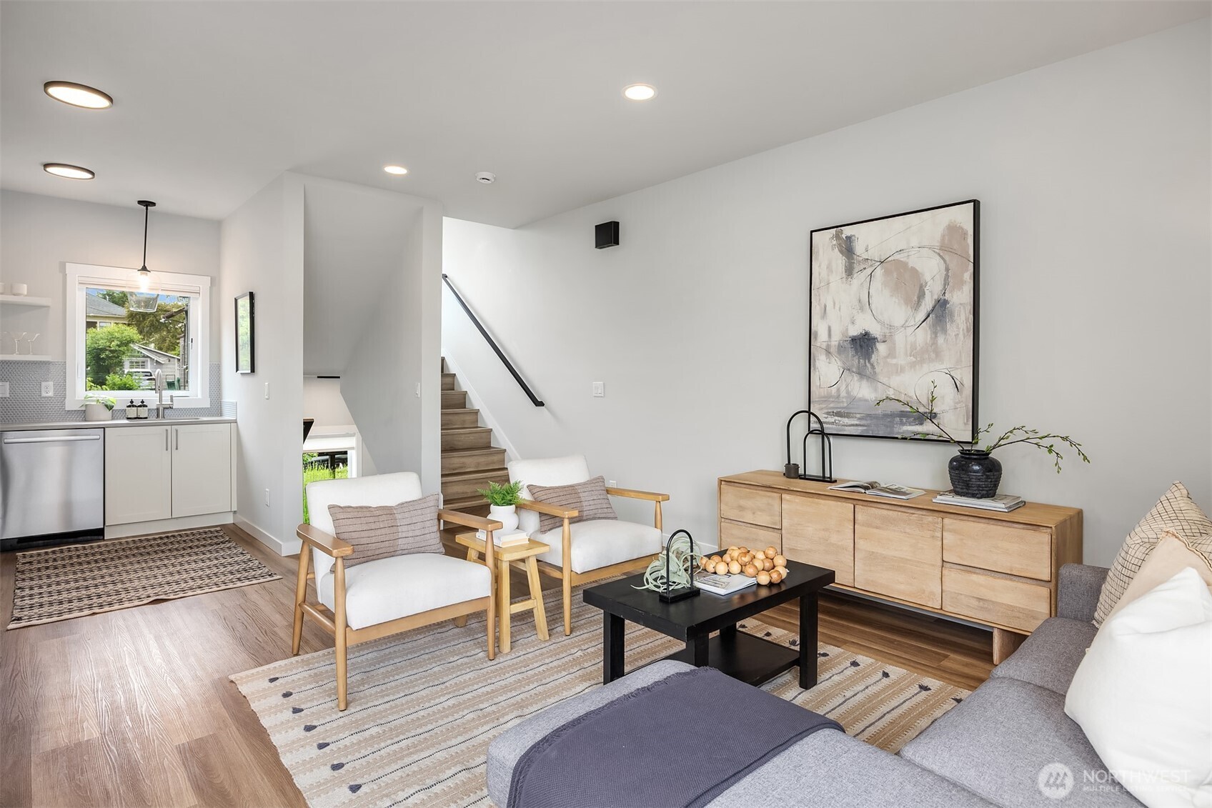 516 North 61st Street, Unit B Seattle, WA 98103 - Photo 5 of 17 a living room with furniture a fireplace and wooden floor