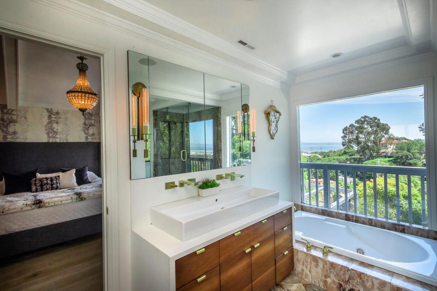 2651 Summit Drive Burlingame, CA 94010 - Photo 17 of 36 a bathroom with a tub sink and mirror