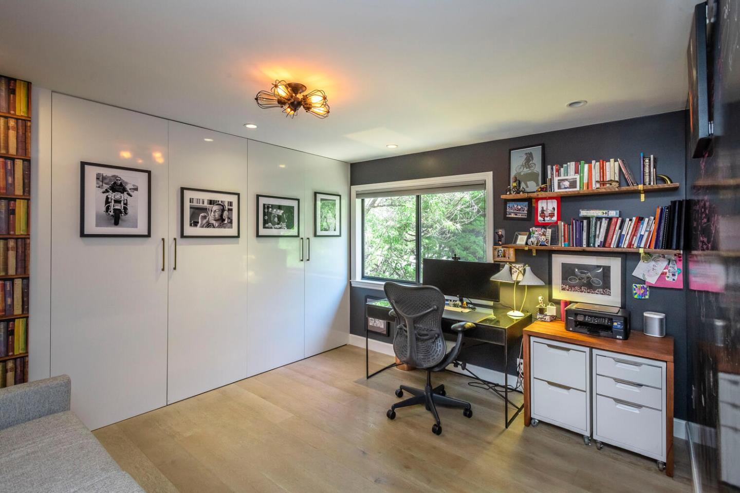 2651 Summit Drive Burlingame, CA 94010 - Photo 19 of 36 a view of a workspace with furniture and a bookshelf