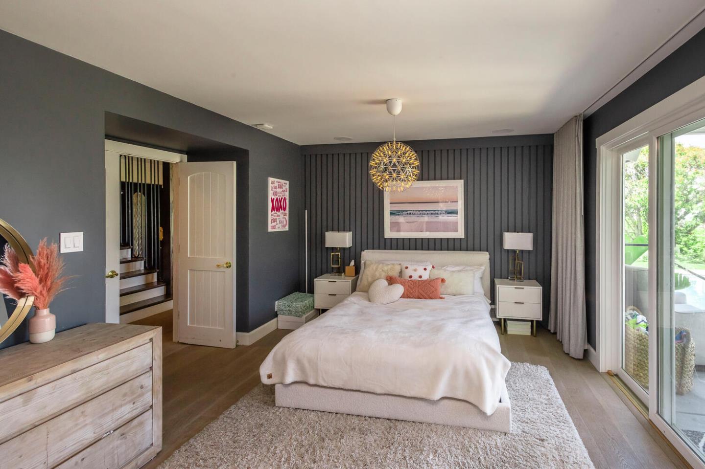 2651 Summit Drive Burlingame, CA 94010 - Photo 23 of 36 a bedroom with a large bed and a dresser