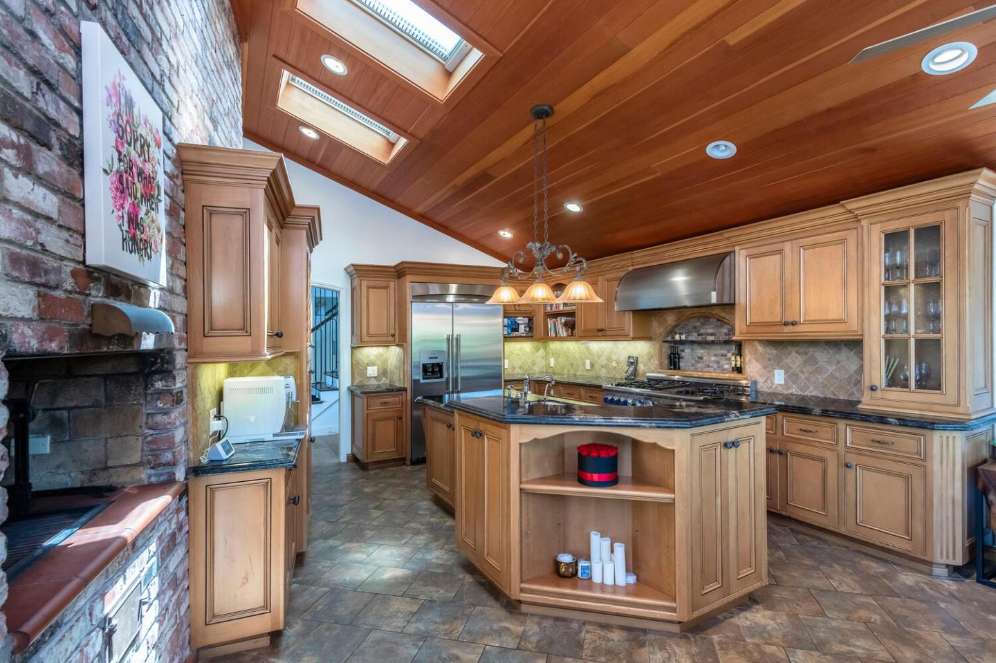 2651 Summit Drive Burlingame, CA 94010 - Photo 8 of 36 a kitchen with a stove and a sink