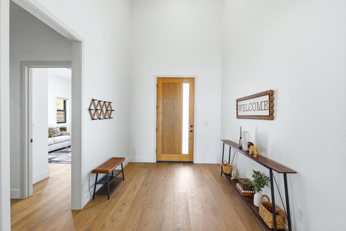 2033 Quiver Street Copperopolis, CA 95228 - Photo 4 of 40 a view of a hallway with wooden floor and furniture