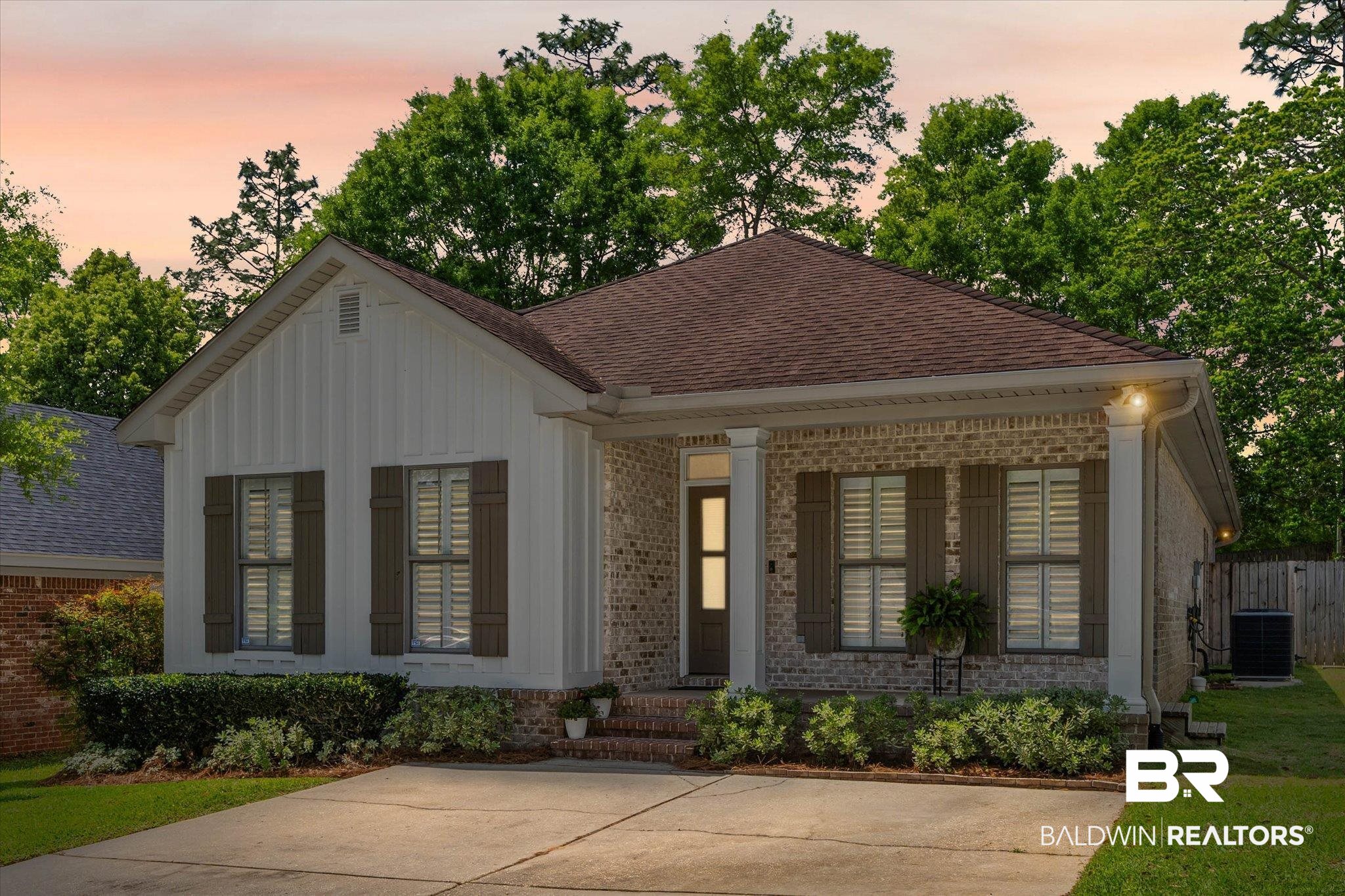 1052 Linlen Avenue Mobile, AL 36609 - Photo 2 of 22 View of front of house featuring covered porch, brick siding, and a shingled roof