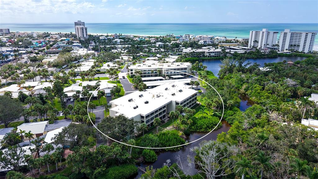 225 Hour Glass Way, Unit 202 Sarasota, FL 34242 - Photo 2 of 68 a view of a lake