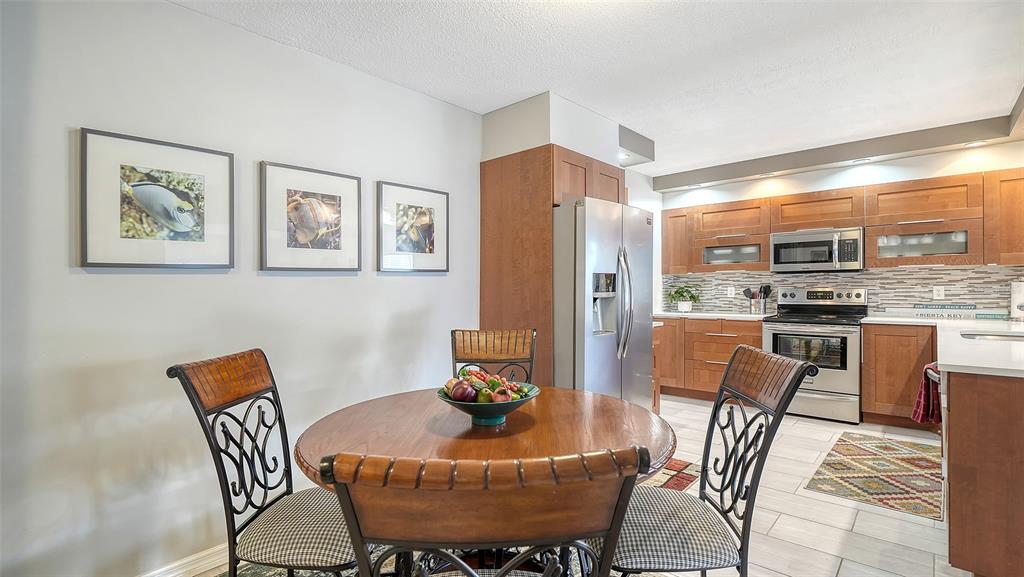 225 Hour Glass Way, Unit 202 Sarasota, FL 34242 - Photo 7 of 68 a view of a dining room with furniture