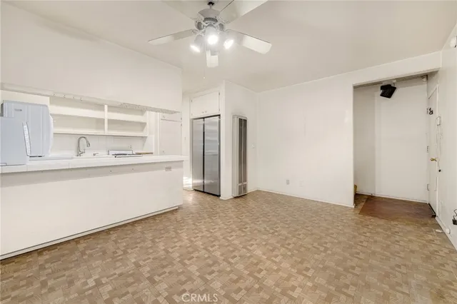 a view of kitchen with wooden floor and window