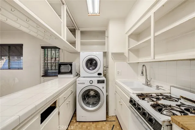 a kitchen with a stove and a sink