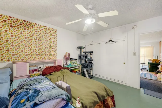 a bed room with a bed and a couch