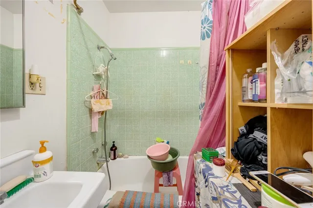 a bathroom with a sink mirror vanity and toilet