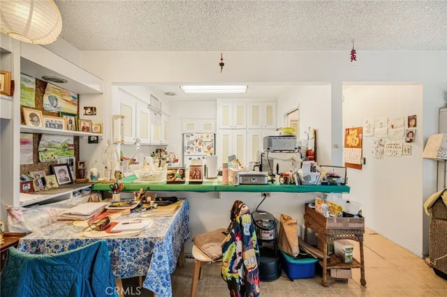 a view of a dining room with furniture water and kitchen view