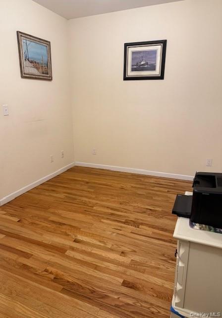 120 East 6th Road Queens, NY 11693 - Photo 11 of 20 a view of a room with wooden floor and white walls