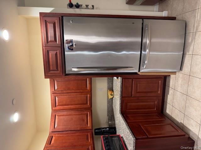 120 East 6th Road Queens, NY 11693 - Photo 3 of 20 a kitchen with stainless steel appliances granite countertop a refrigerator a sink and cabinets