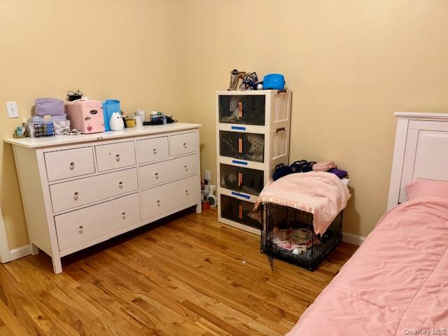 120 East 6th Road Queens, NY 11693 - Photo 6 of 20 a bedroom with a bed and a cabinets