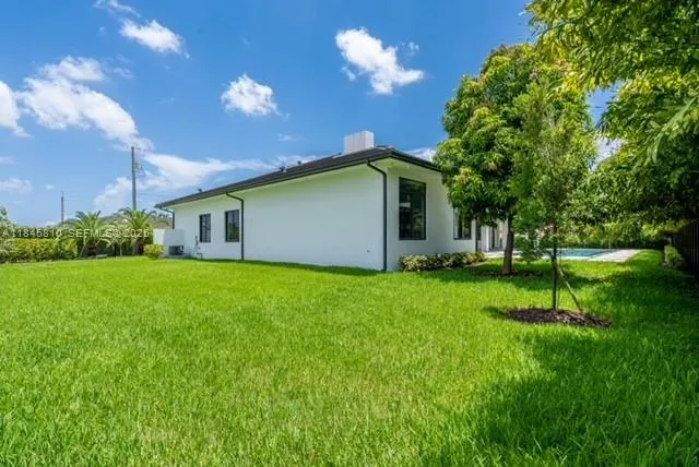 a kitchen with kitchen island a counter top a sink stainless steel appliances and cabinets