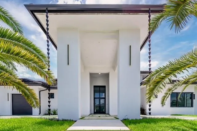 a front view of house with yard and green space