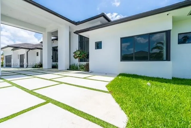 a front view of house with yard and green space