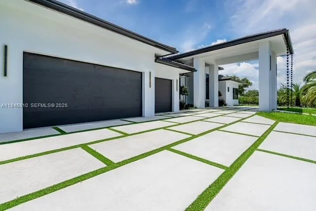 a view of backyard with a patio
