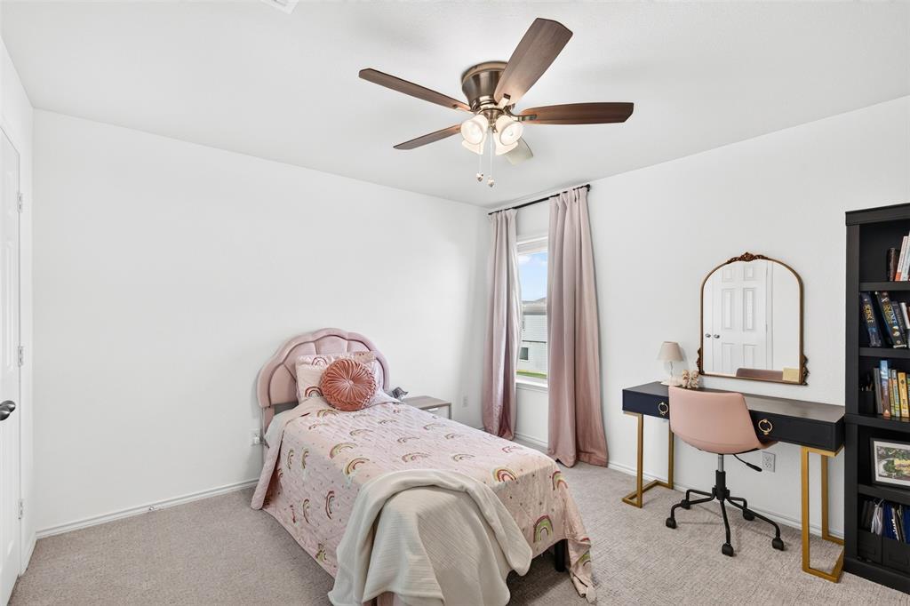 3105 Marston Road Lorena, TX 76655 - Photo 28 of 40 Carpeted interior room featuring a ceiling fan with integrated lighting, a single window with drapes, and white walls