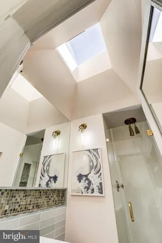 a bathroom with a bathtub and shower