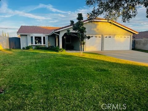 1697 North Fillmore Avenue Rialto, CA 92376 - Photo 2 of 5 a front view of house with yard and swimming pool