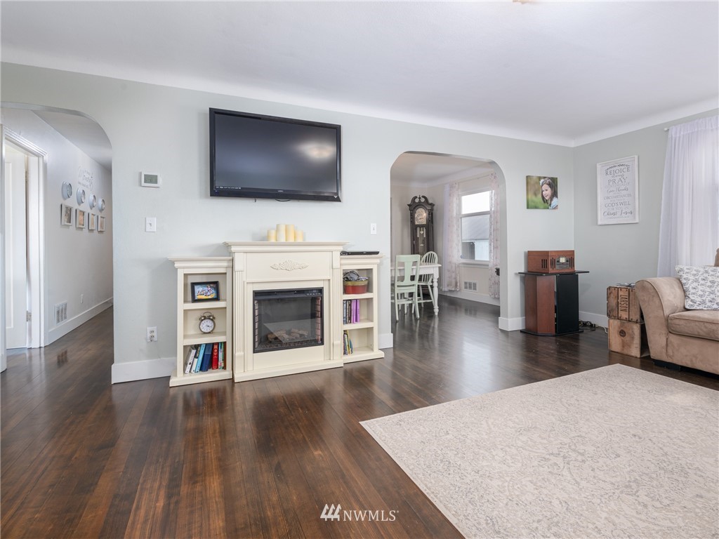 156 Sareault Road Toledo, WA 98591 - Photo 4 of 29 a living room with fireplace furniture and a flat screen tv