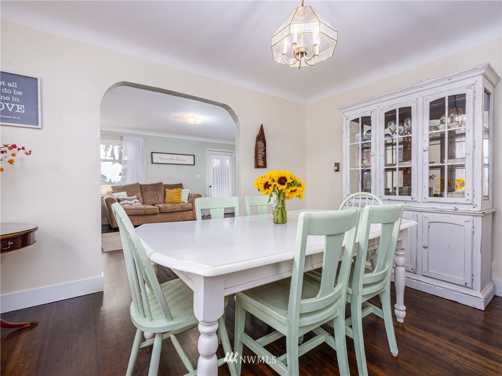 156 Sareault Road Toledo, WA 98591 - Photo 5 of 29 a view of a dining room with furniture and wooden floor