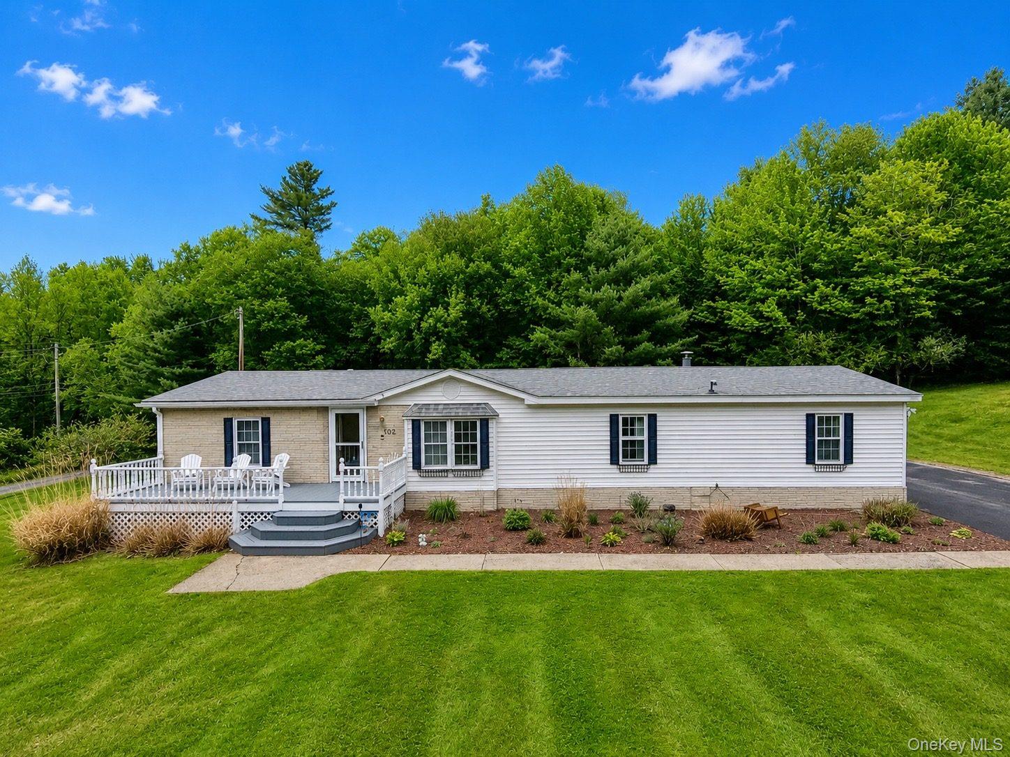 502 Myers Road Neversink, NY 12765 - Photo 1 of 38 a front view of house with yard and outdoor seating