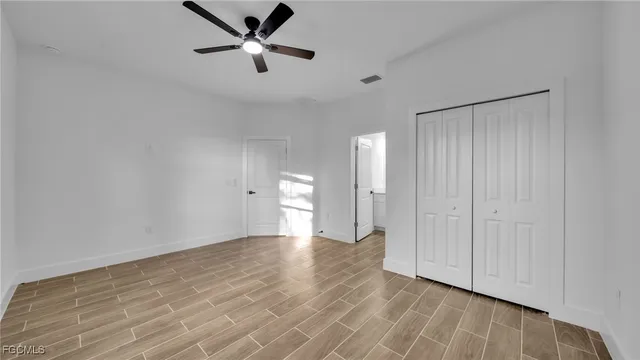 a bathroom with a sink a toilet a mirror and shower
