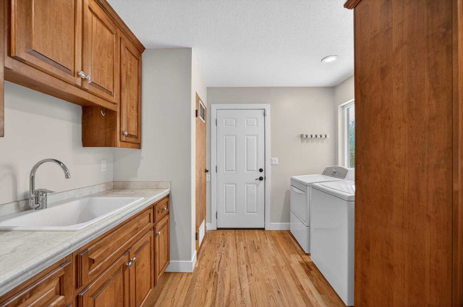 5560 Ralston Way Placerville, CA 95667 - Photo 34 of 78 Utility room featuring ample room and cabinetry.