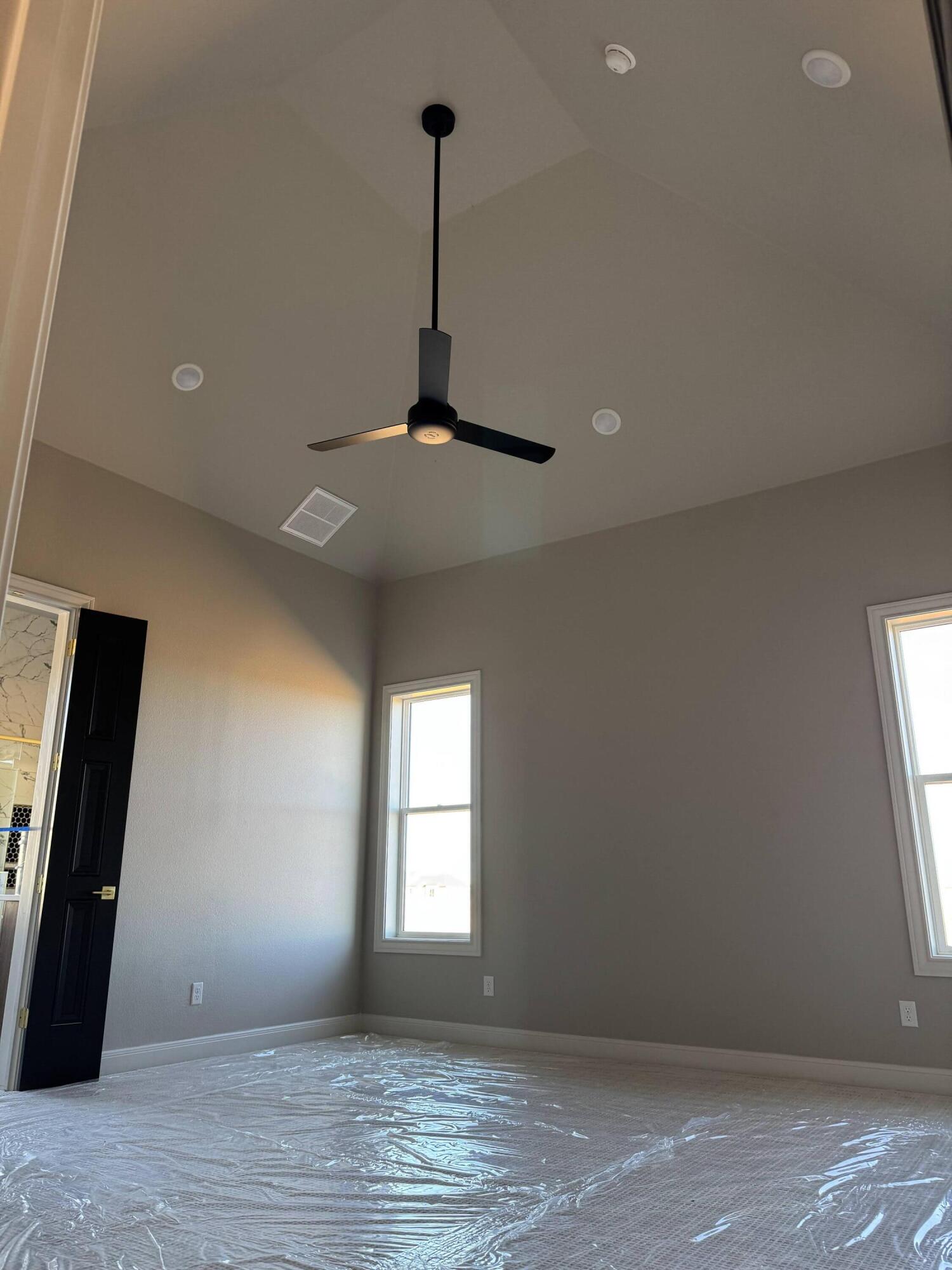 309 Maple New Home, TX 79381 - Photo 11 of 27 a view of an empty room with window and chandelier fan