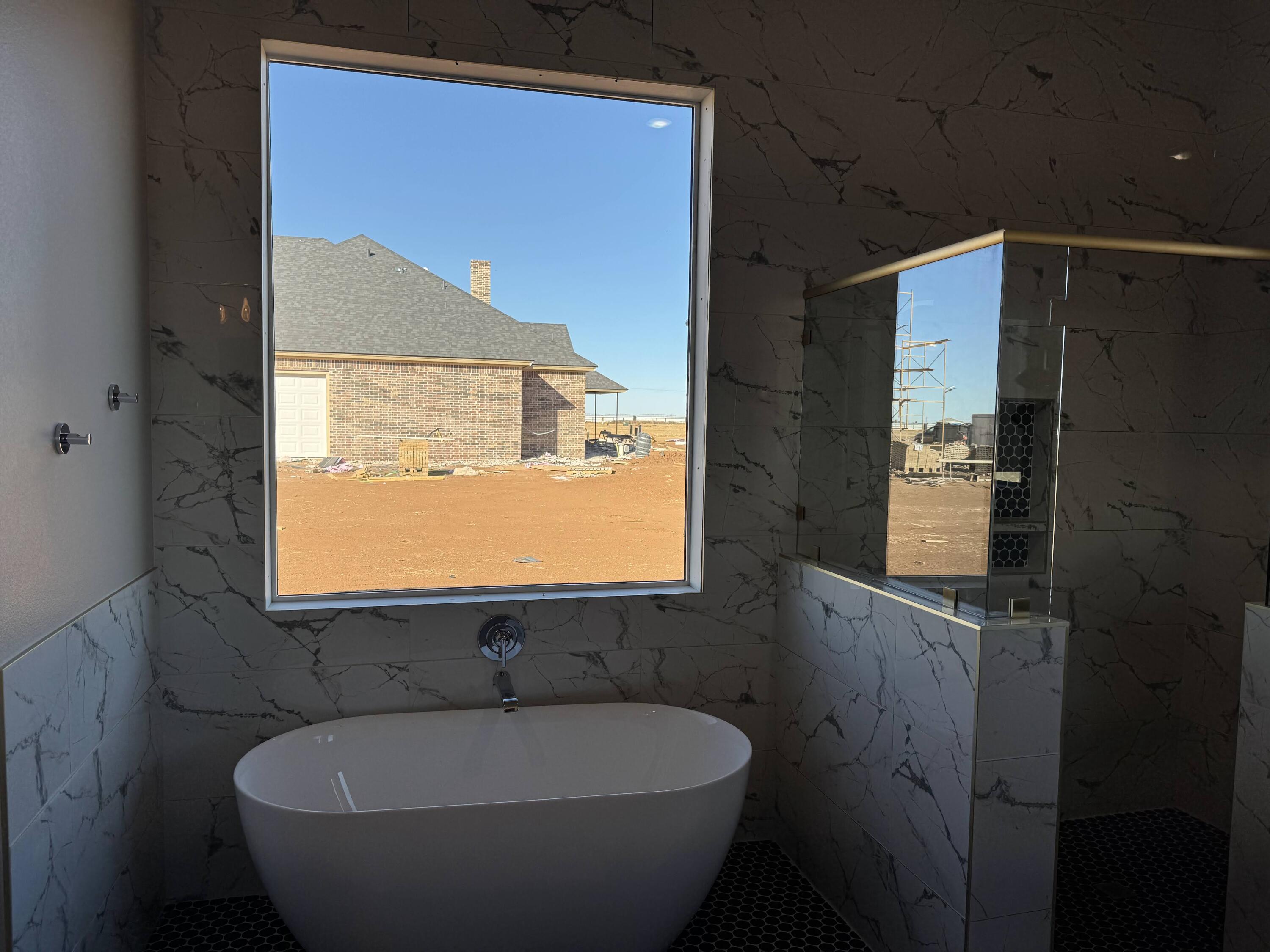 309 Maple New Home, TX 79381 - Photo 14 of 27 a bathroom with a sink and a mirror