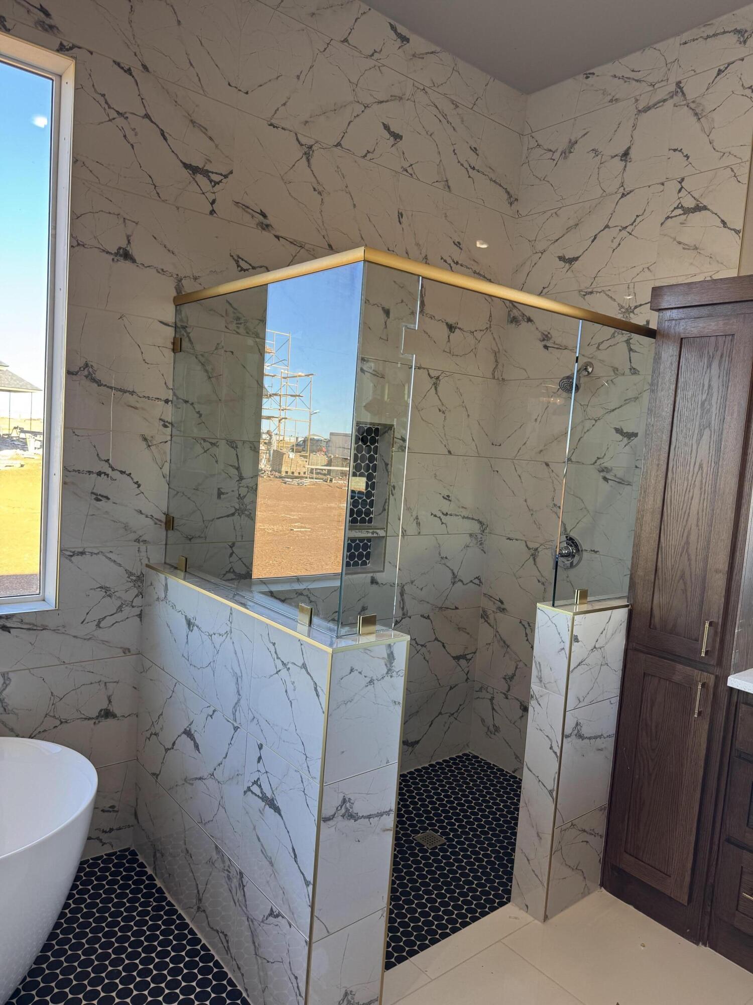 309 Maple New Home, TX 79381 - Photo 15 of 27 a bathroom with a sink toilet and shower