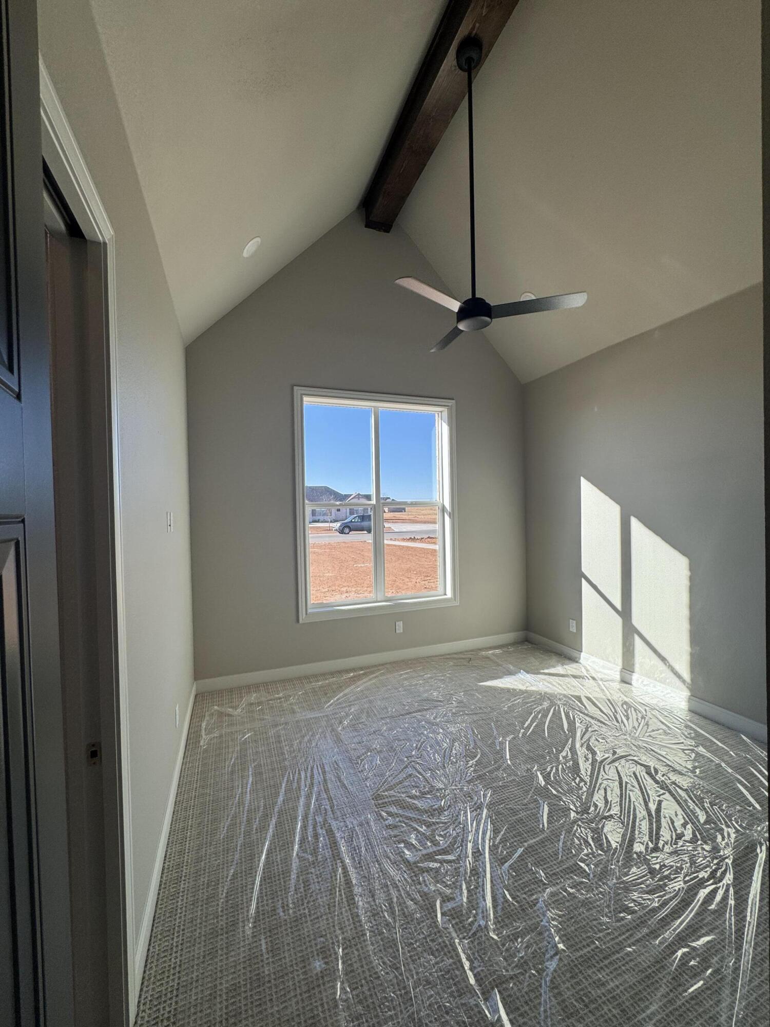 309 Maple New Home, TX 79381 - Photo 16 of 27 a view of a livingroom with a ceiling fan and window