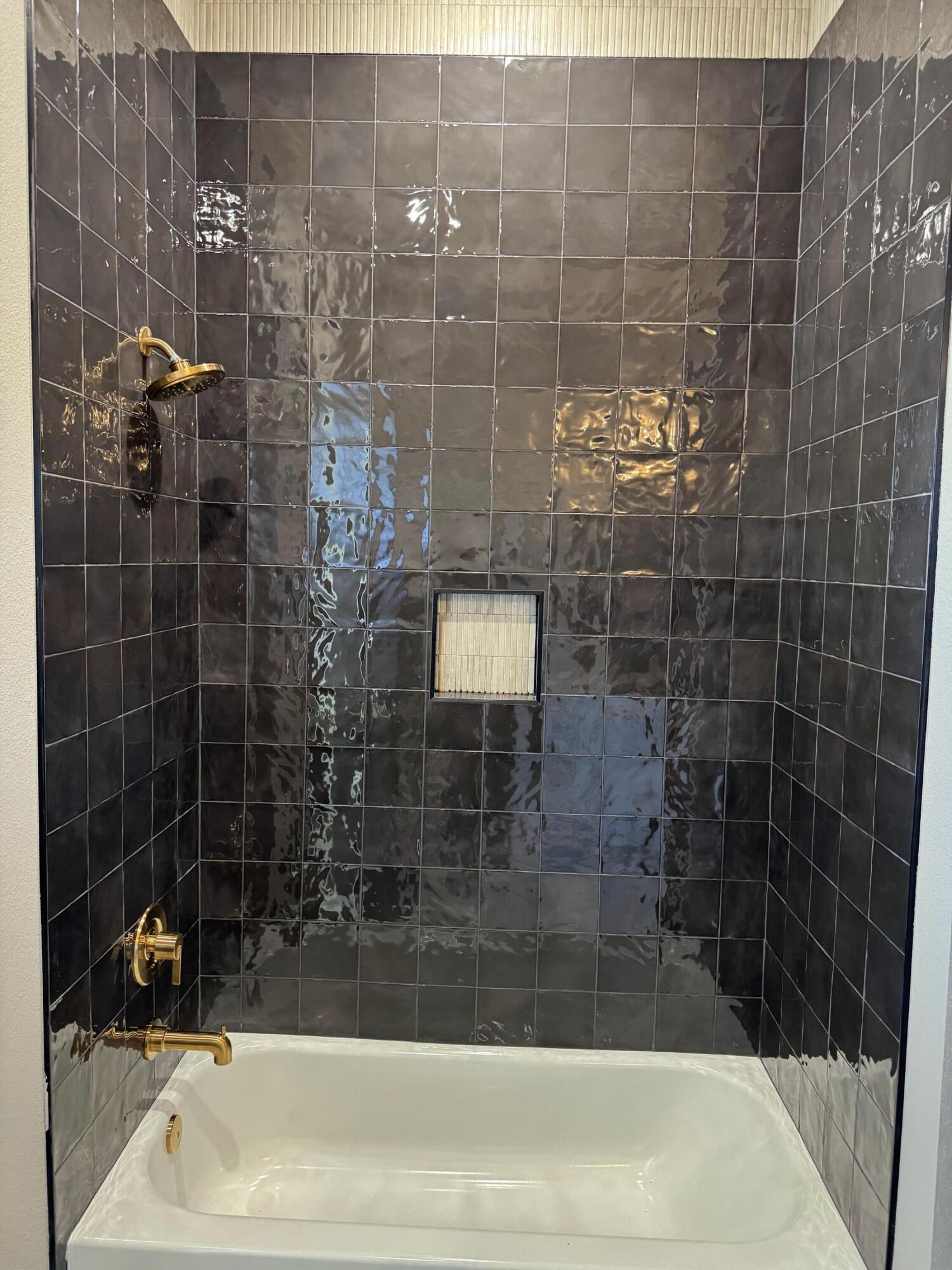 309 Maple New Home, TX 79381 - Photo 17 of 27 a bathroom with a bathtub