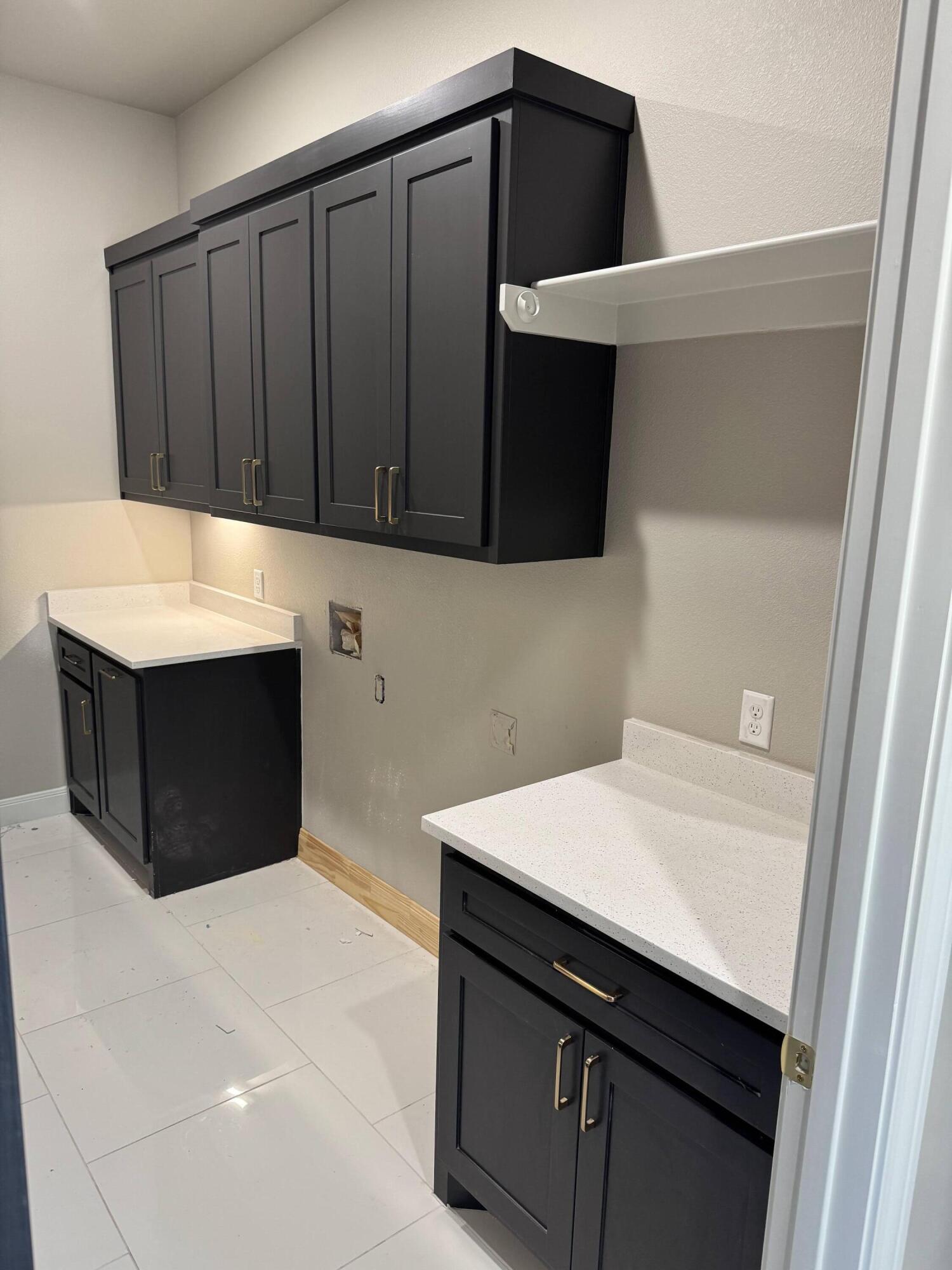 309 Maple New Home, TX 79381 - Photo 23 of 27 a kitchen with a sink dishwasher and cabinets
