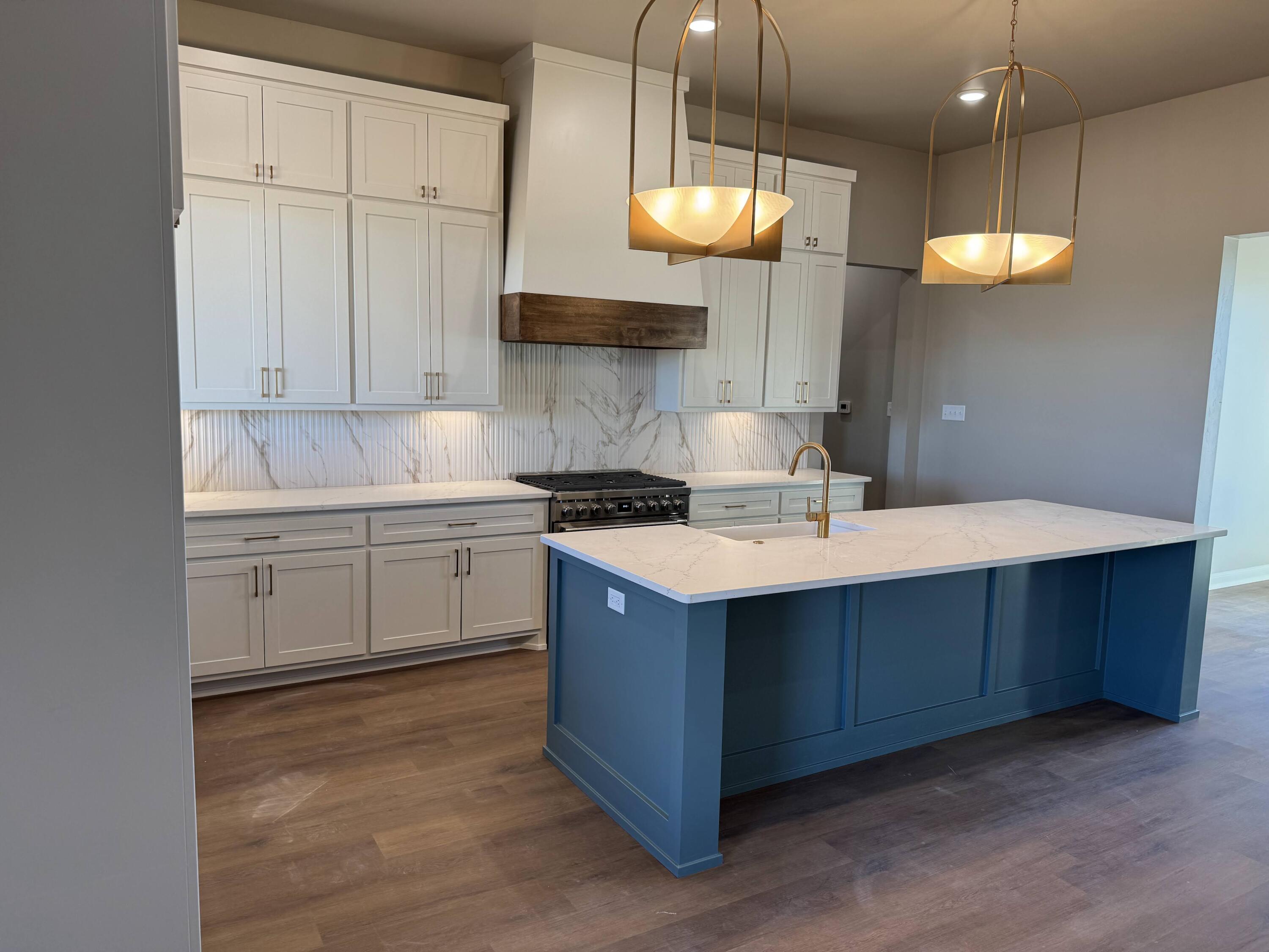 309 Maple New Home, TX 79381 - Photo 5 of 27 a kitchen with a sink cabinets and window