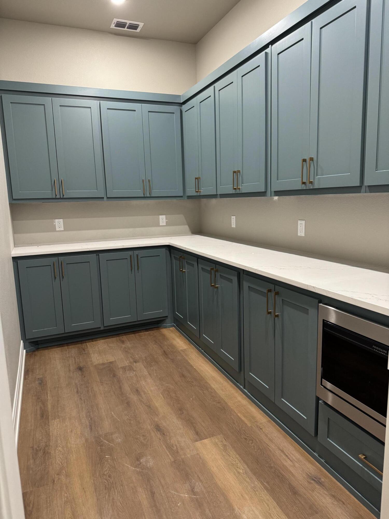 309 Maple New Home, TX 79381 - Photo 9 of 27 a view of a kitchen with wooden floor