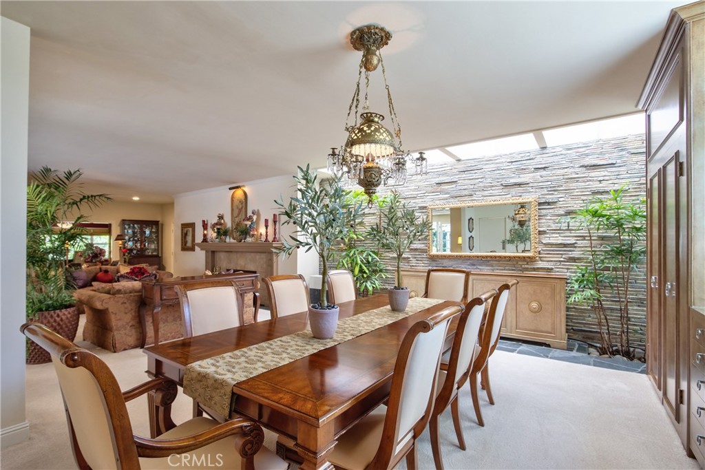 1175 Riverview Drive Fallbrook, CA 92028 - Photo 16 of 57 a dining room with furniture a chandelier and wooden floor