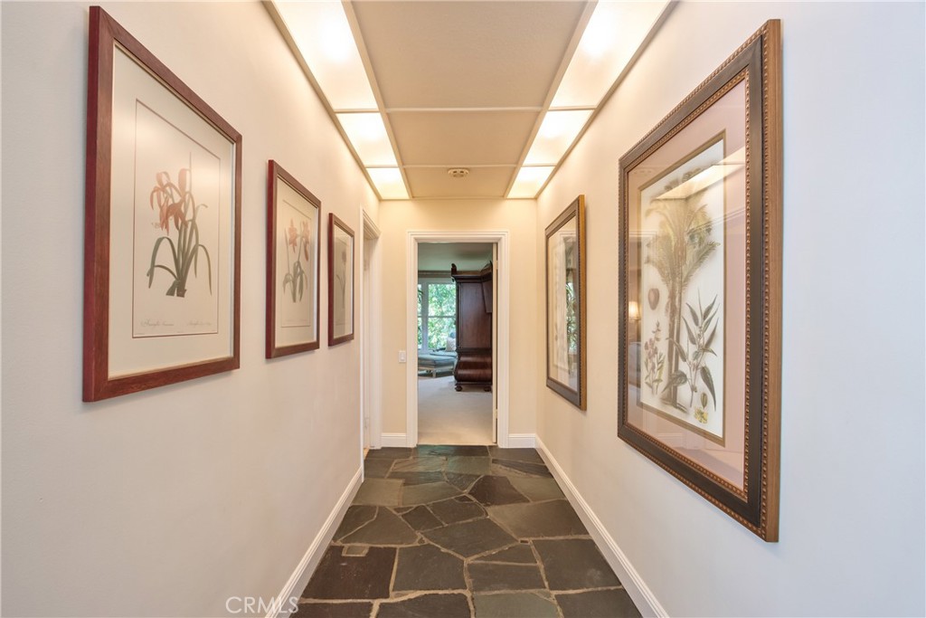 1175 Riverview Drive Fallbrook, CA 92028 - Photo 22 of 57 a view of a hallway with wooden floor and windows