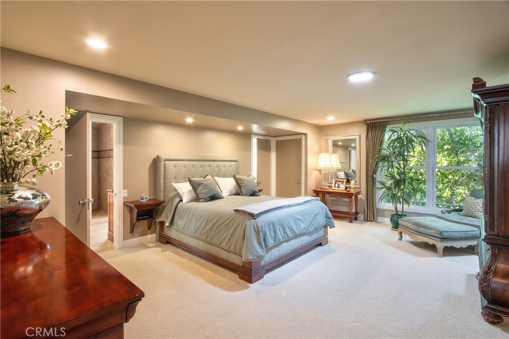 1175 Riverview Drive Fallbrook, CA 92028 - Photo 23 of 57 a spacious bedroom with a bed and large windows