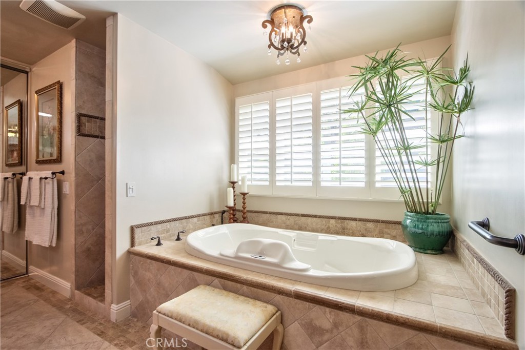 1175 Riverview Drive Fallbrook, CA 92028 - Photo 26 of 57 a bath tub sitting in a bathroom next to a window