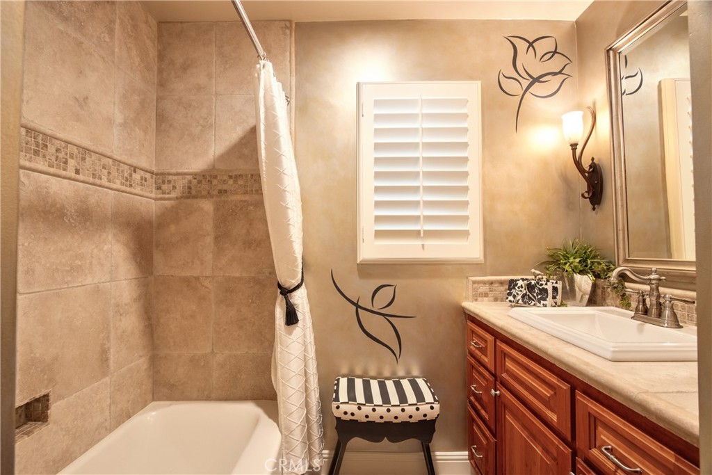 1175 Riverview Drive Fallbrook, CA 92028 - Photo 29 of 57 a bathroom with a sink and a mirror