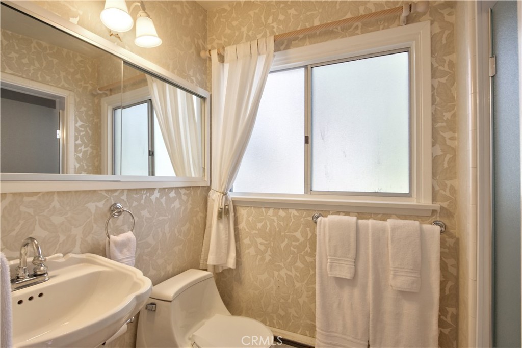 1175 Riverview Drive Fallbrook, CA 92028 - Photo 33 of 57 a bathroom with a sink a toilet and a mirror
