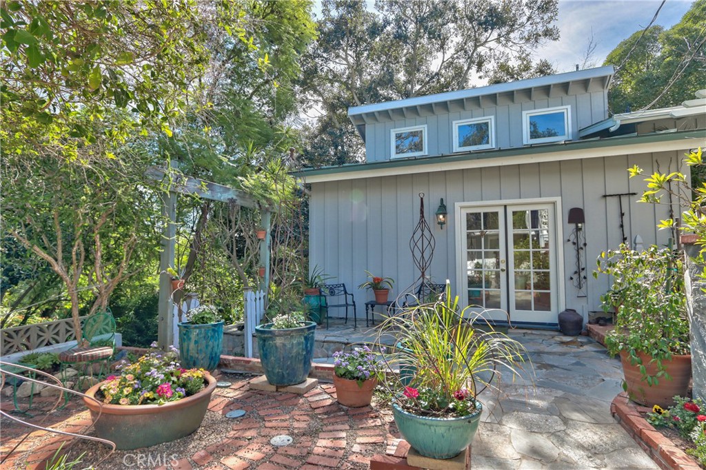 1175 Riverview Drive Fallbrook, CA 92028 - Photo 34 of 57 a view of a backyard with chair and potted plants