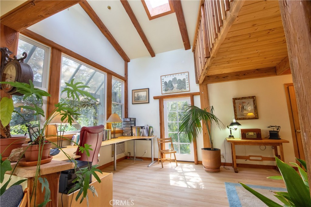 1175 Riverview Drive Fallbrook, CA 92028 - Photo 39 of 57 a living room with furniture a large window and wooden floor