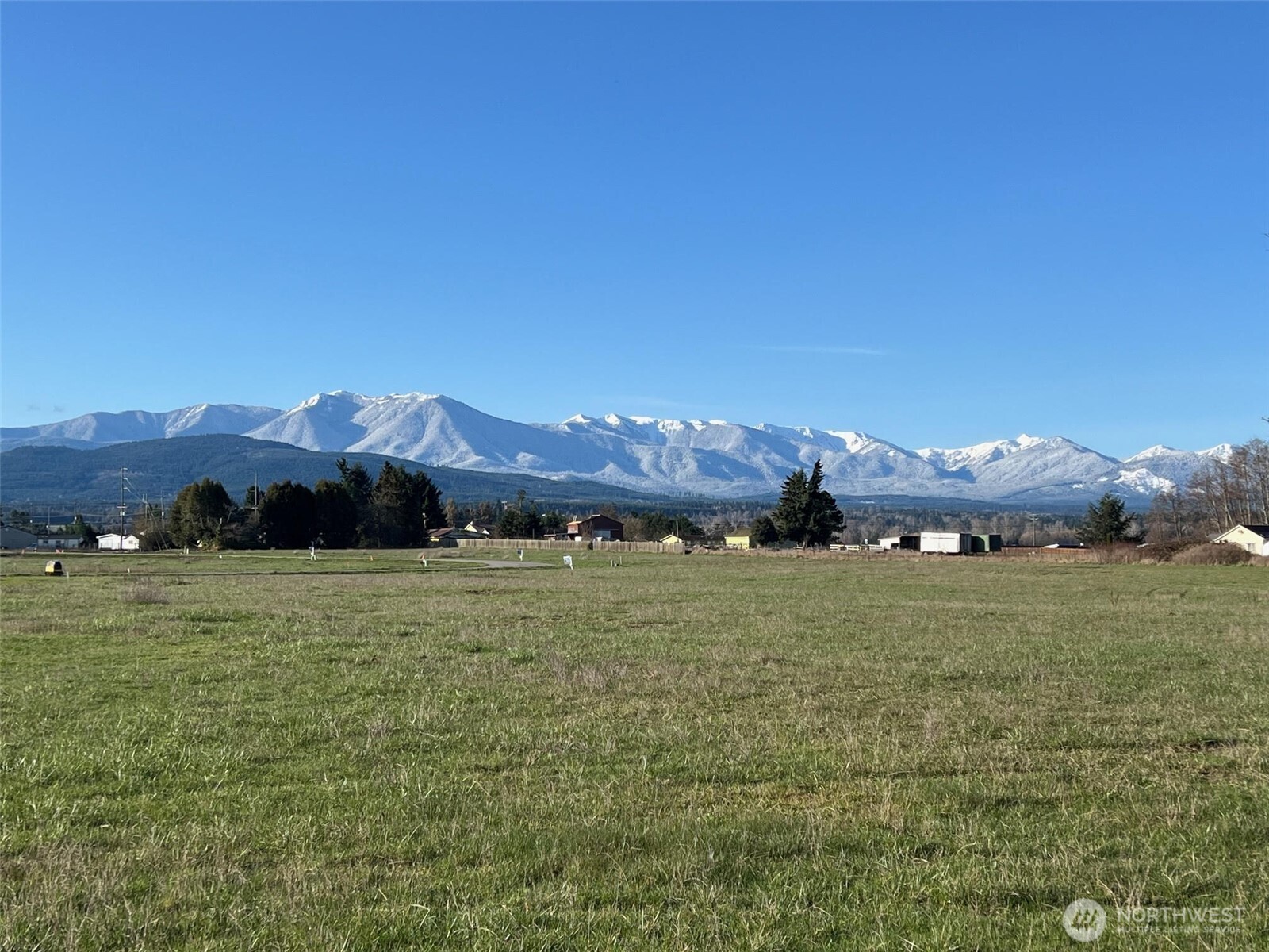 9999 Lange Lane Sequim, WA 98382 - Photo 2 of 16 a view of an ocean and a yard