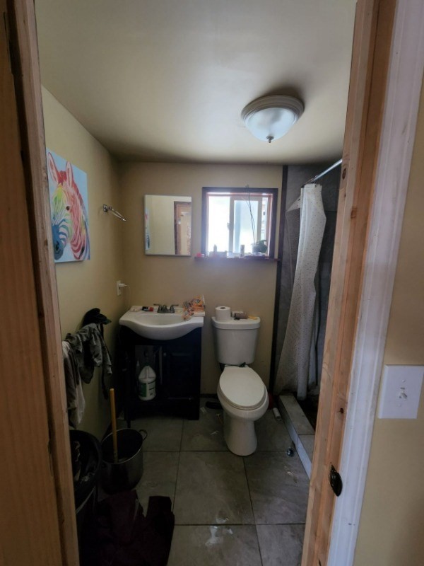 15-2951 Pahoa Village Road Pahoa, HI 96778 - Photo 14 of 18 a bathroom with a toilet sink and mirror