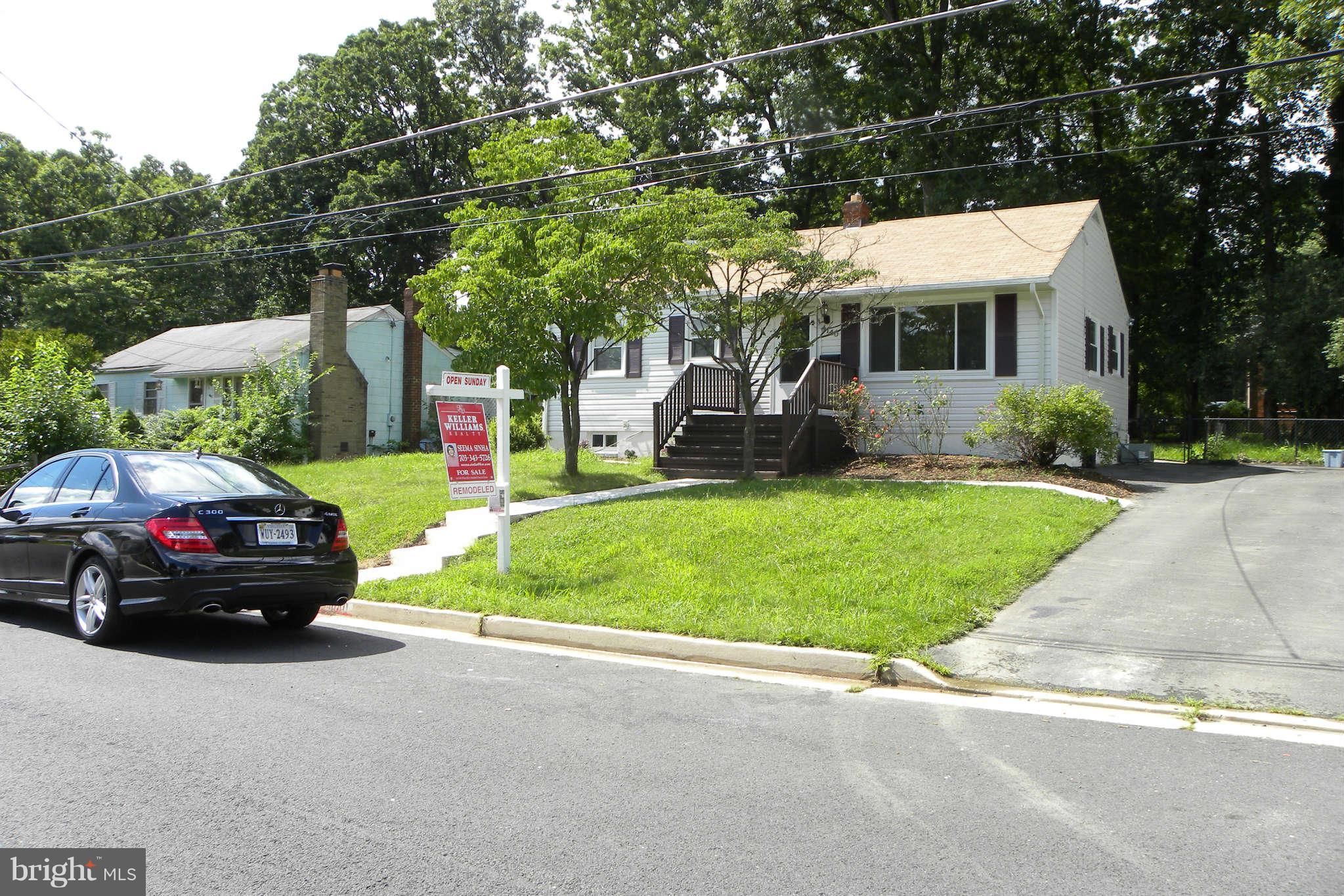4140 Addison Road Fairfax, VA 22030 - Photo 1 of 27 a car parked in front of a house